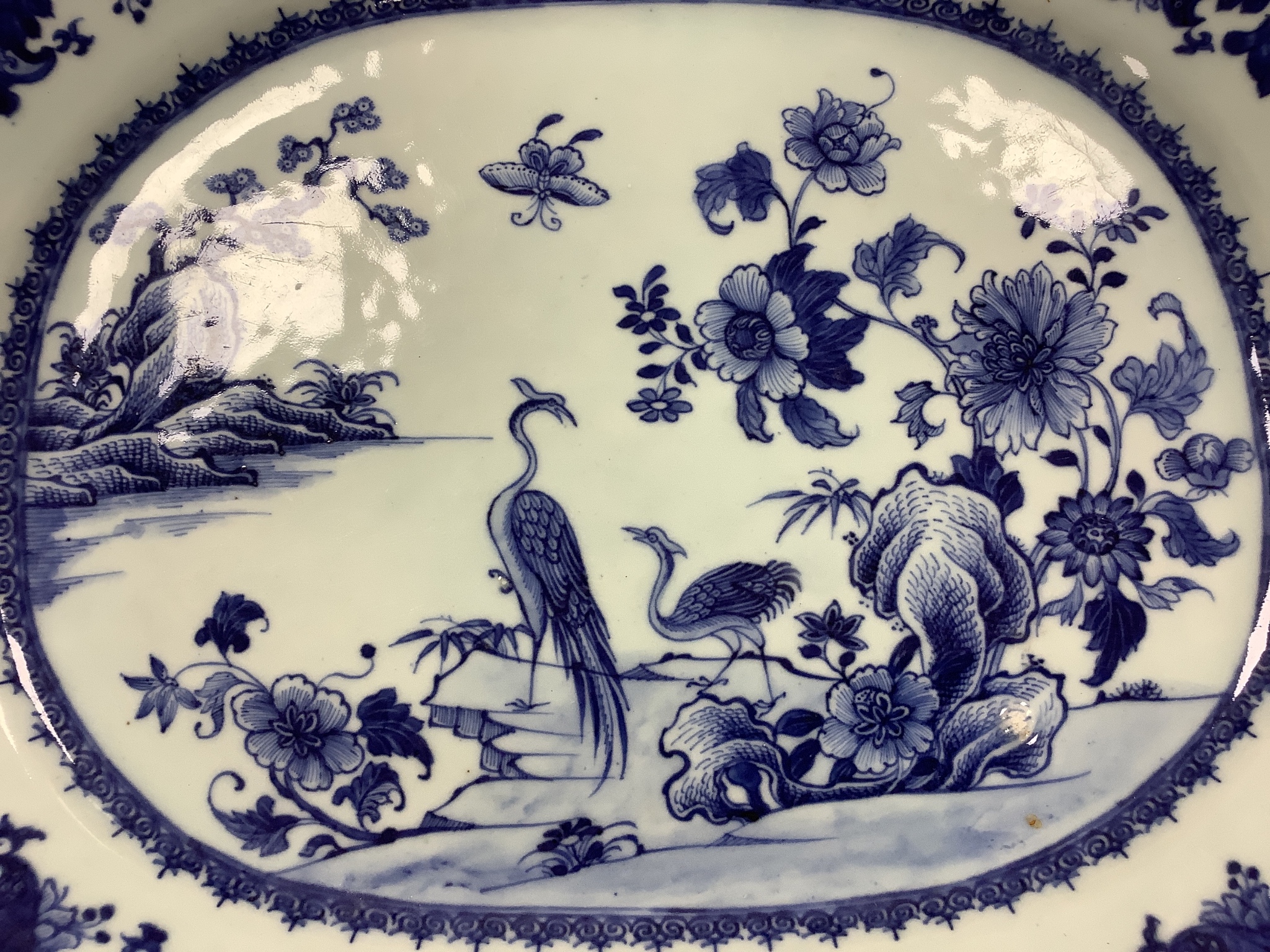 Two 18th century Chinese export blue and white meat dishes, largest 43cm